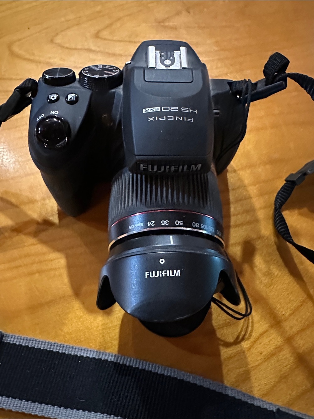 Fujifilm Black Camera Body with Black Lens and Red Trim